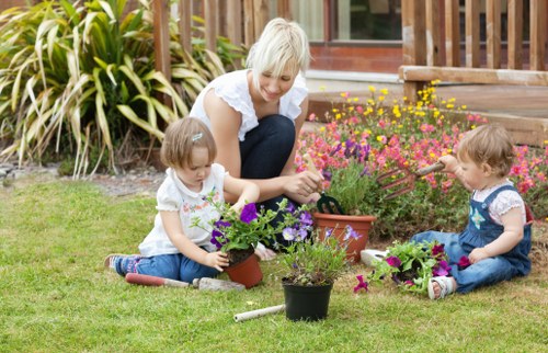 Gardener Wallington team preparing tools at a garden entrance
